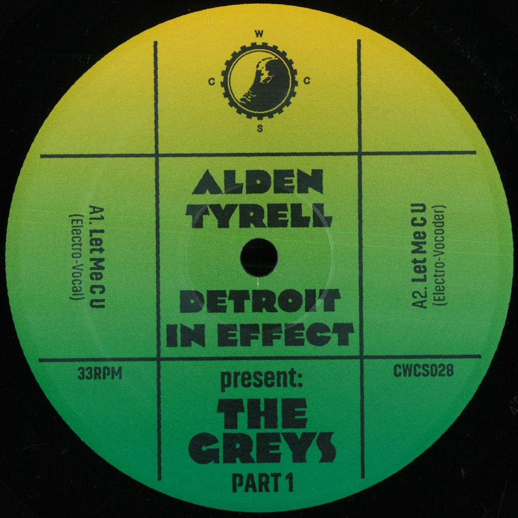 A circular vinyl record label for Alden Tyrell's 'Detroit In Effect' Part 1, presented by The Greys. The label features a vibrant green-to-yellow gradient background with bold black text and a central black spindle hole, set against a solid black record sleeve.